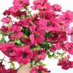 Bouquet of bright pink flowers with green leaves on a white background