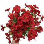 Bouquet of red flowers with green leaves on a white background