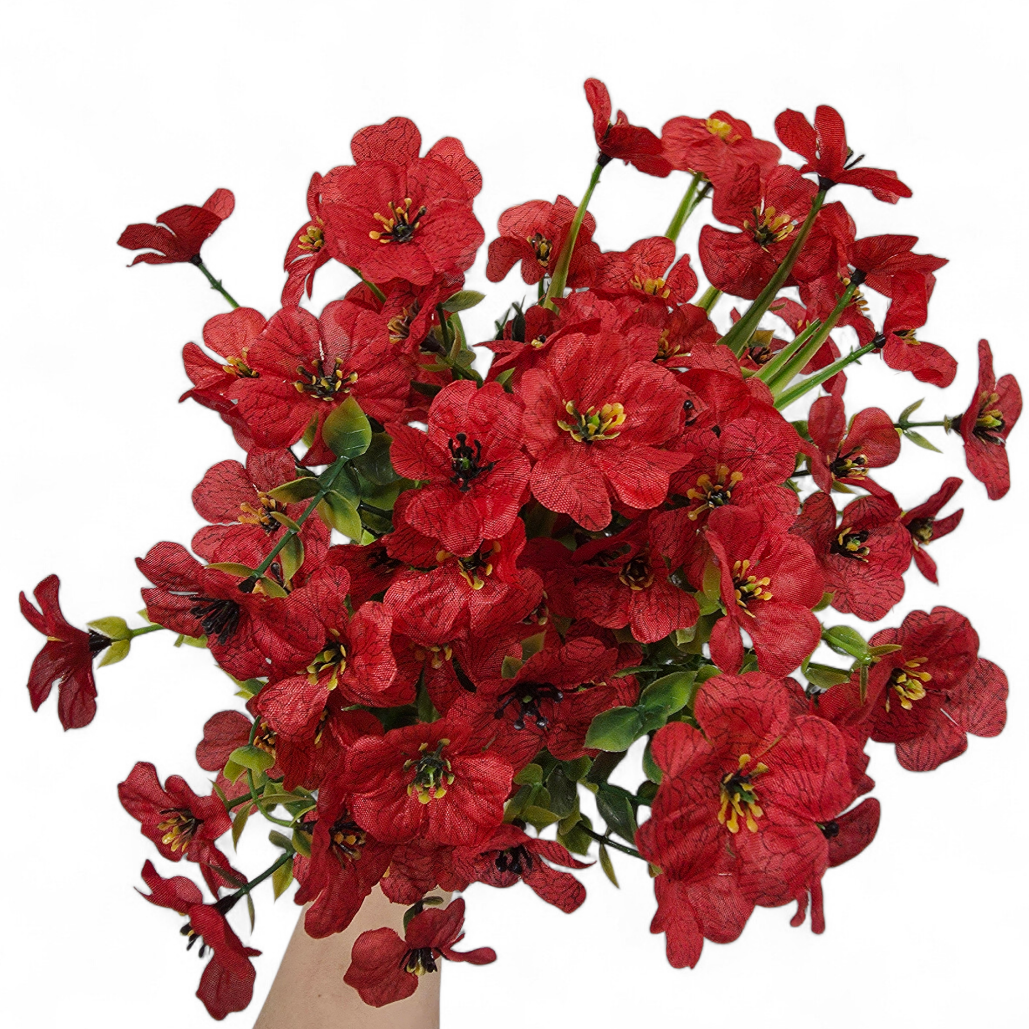 Bouquet of red flowers with green leaves on a white background