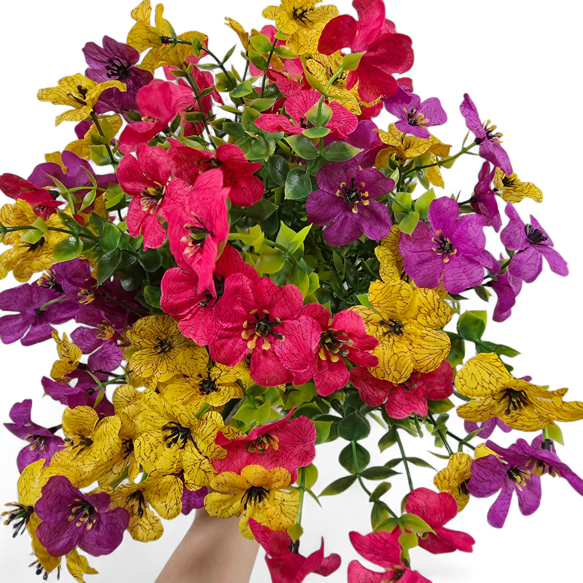Bouquet of colorful flowers including pink, yellow, and purple on a white background