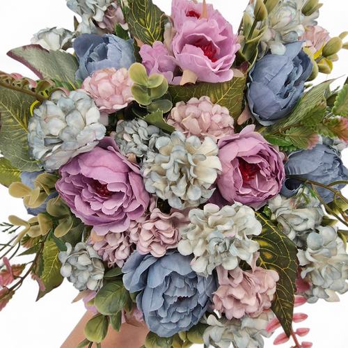 Bouquet of pink, blue, and green flowers held by a hand on a white background
