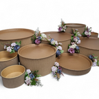 Cardboard bins with floral arrangements on a white background