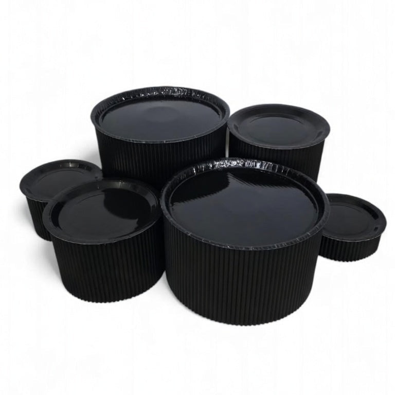 Disposable grazing table kit in all black platters and risers