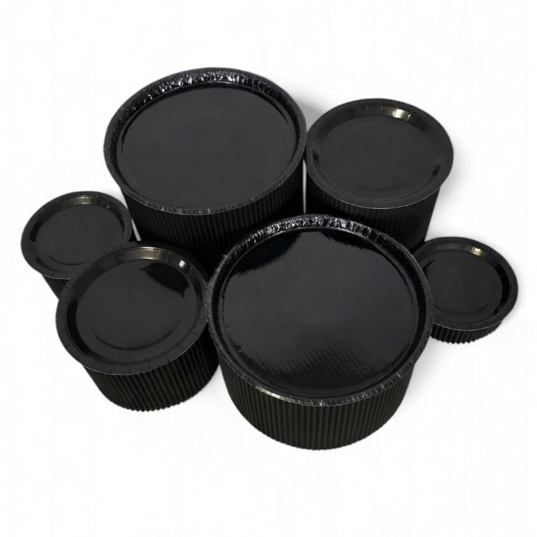 Disposable grazing table kit in all black platters and risers
