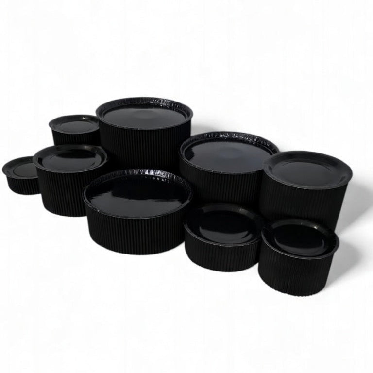 Disposable grazing table kit in all black platters and risers