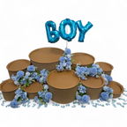 Decorative grazing table kit with blue flowers and 'BOY' balloon on a white background