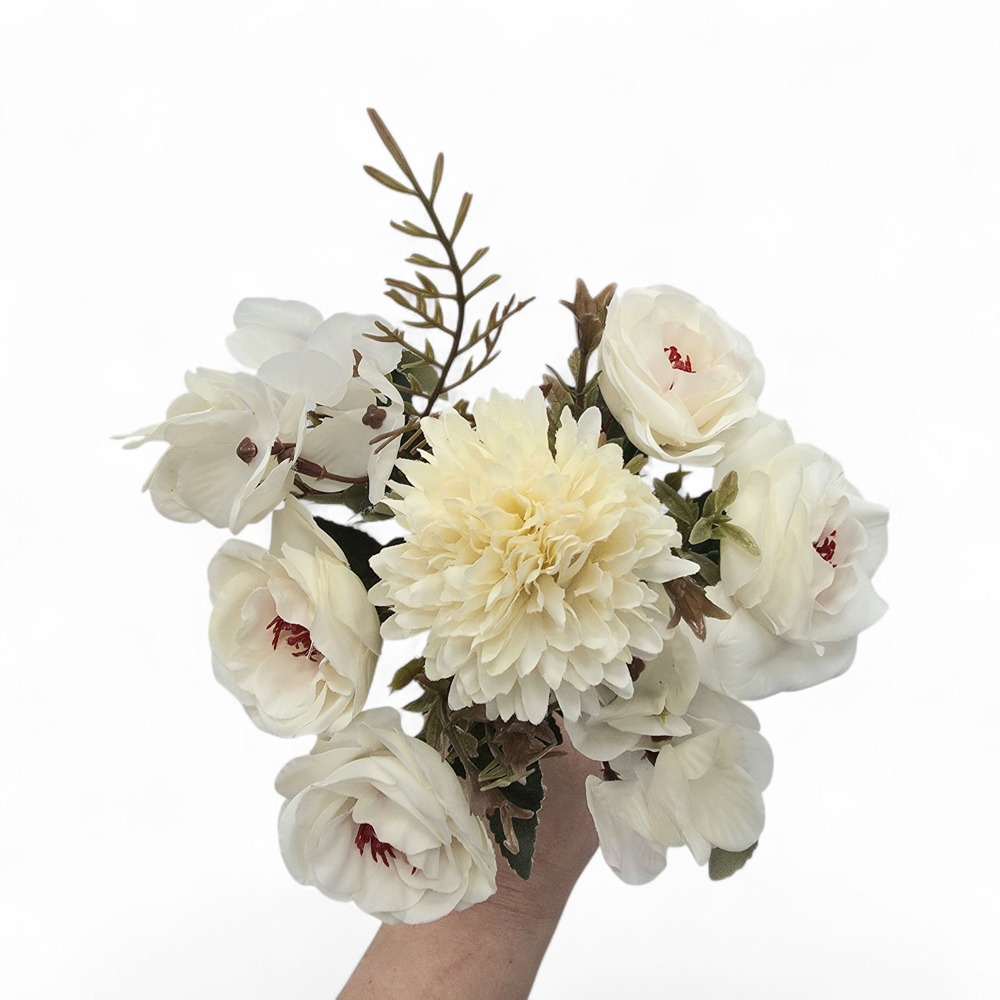 Bouquet of white flowers held by a hand on a white background