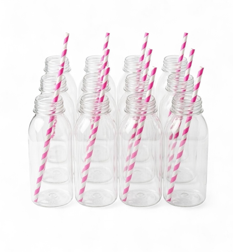 Set of clear plastic bottles with hot pink and white striped straws on a white background