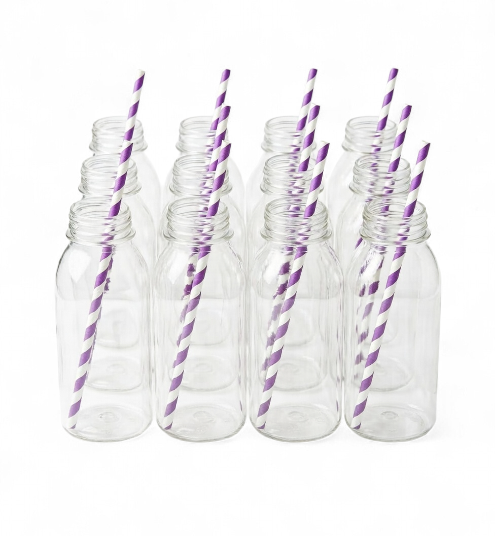 Set of clear plastic bottles with purple and white striped straws on a white background