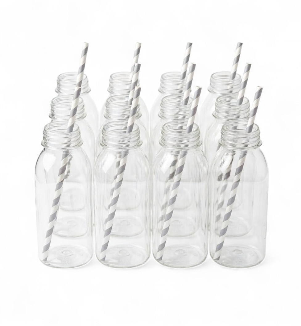 Set of clear plastic bottles with silver straws on a white background