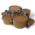 DIY grazing table kit with disposable natural platters plinths and blue steel flowers right view - grazekits