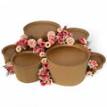 DIY grazing table kit with disposable natural platters plinths and pink steel flowers front view - grazekits