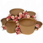 DIY grazing table kit with disposable natural platters plinths and pink steel flowers front view - grazekits