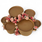 DIY grazing table kit with disposable natural platters plinths and pink steel flowers main view - grazekits