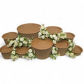 DIY grazing table kit with disposable natural platters plinths and white roses flowers front view - grazekits